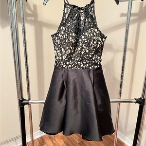 Black lace cocktail dress with satin bow detail